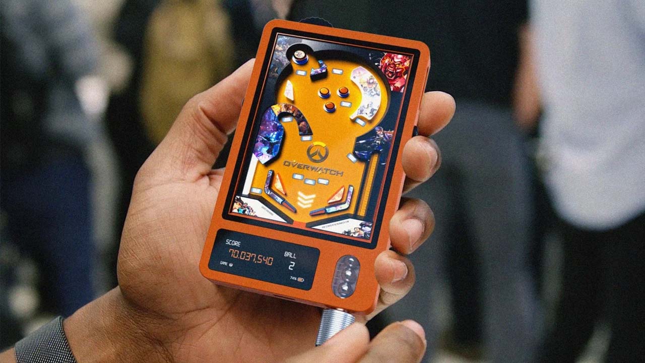 Orange FlipOnGo handheld being held in someone's hand