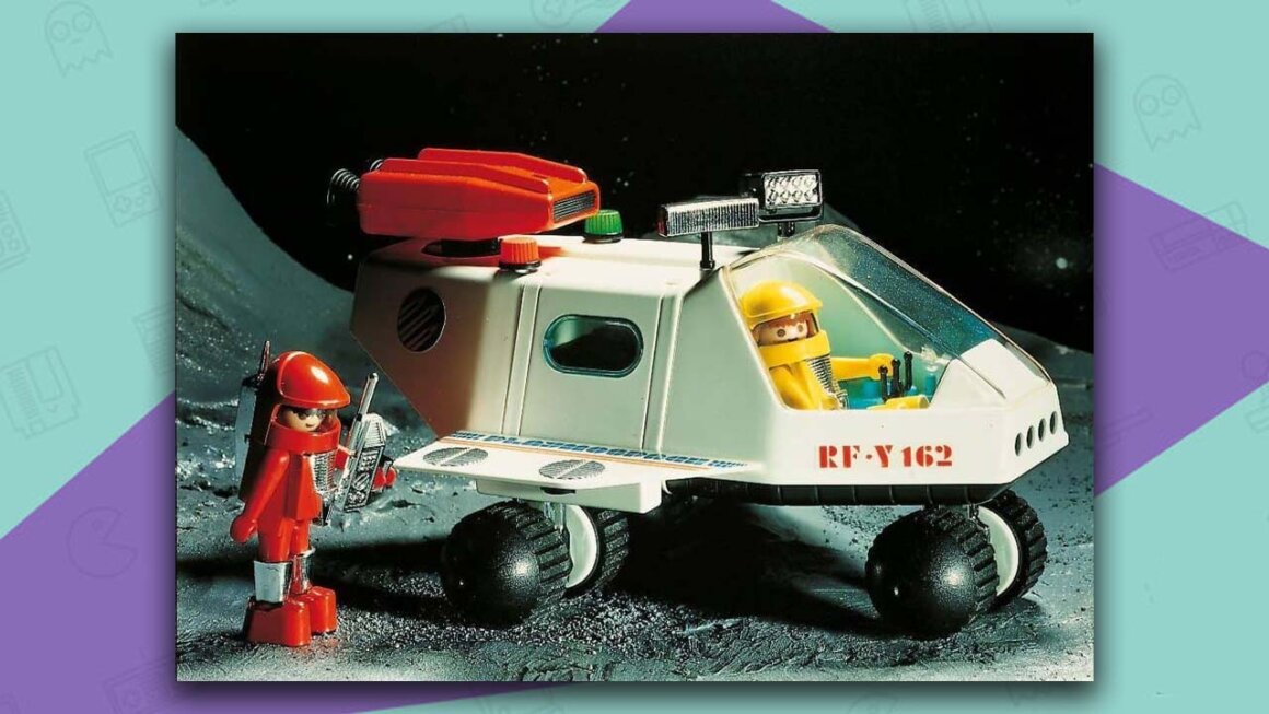 Playmobil space scene with a red-suited figure on a walkie talkie and a yellow-suited figure in a space buggy