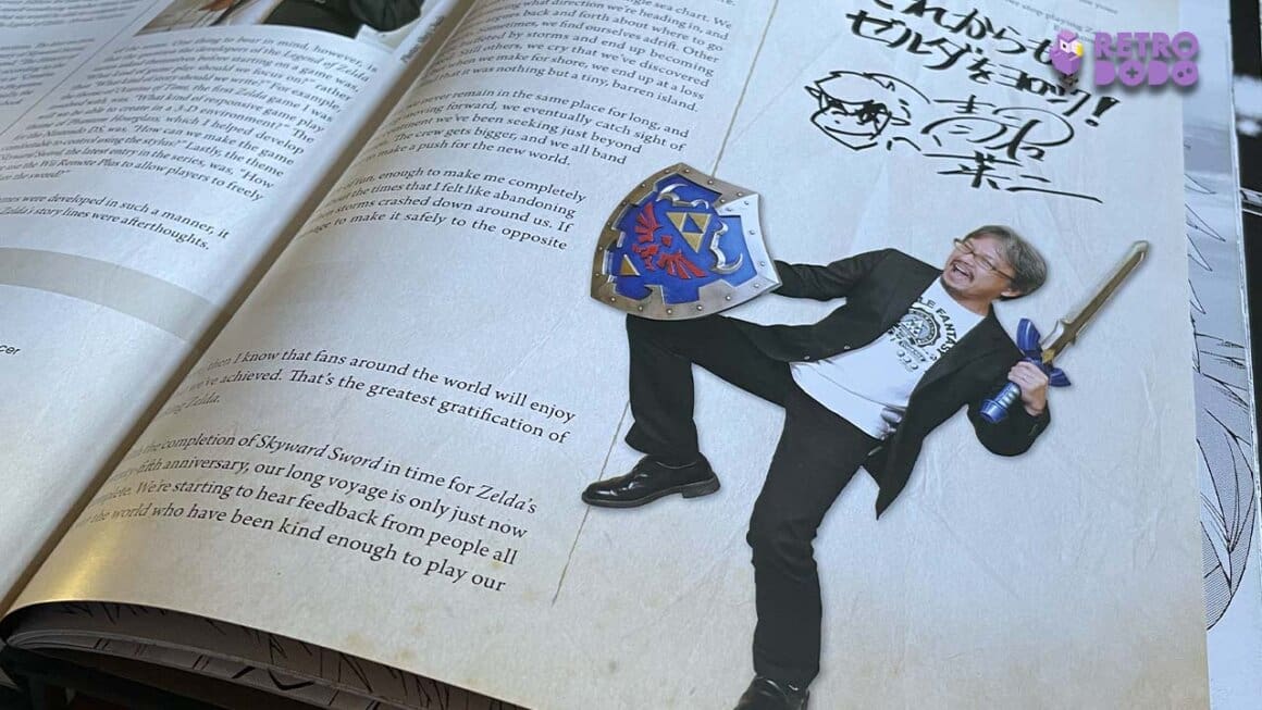 A shot of Seb's Hyrule Historia book showing Eiji holding Link's weapons