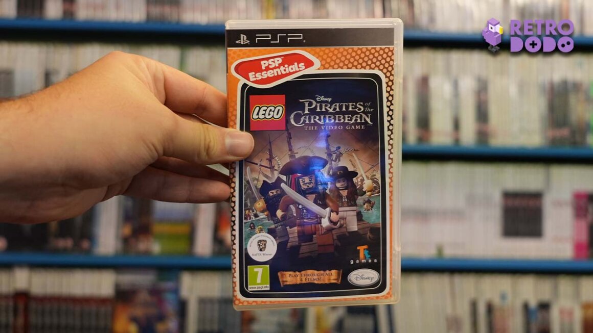 Brandon holding a copy of Lego Pirates of the Caribbean