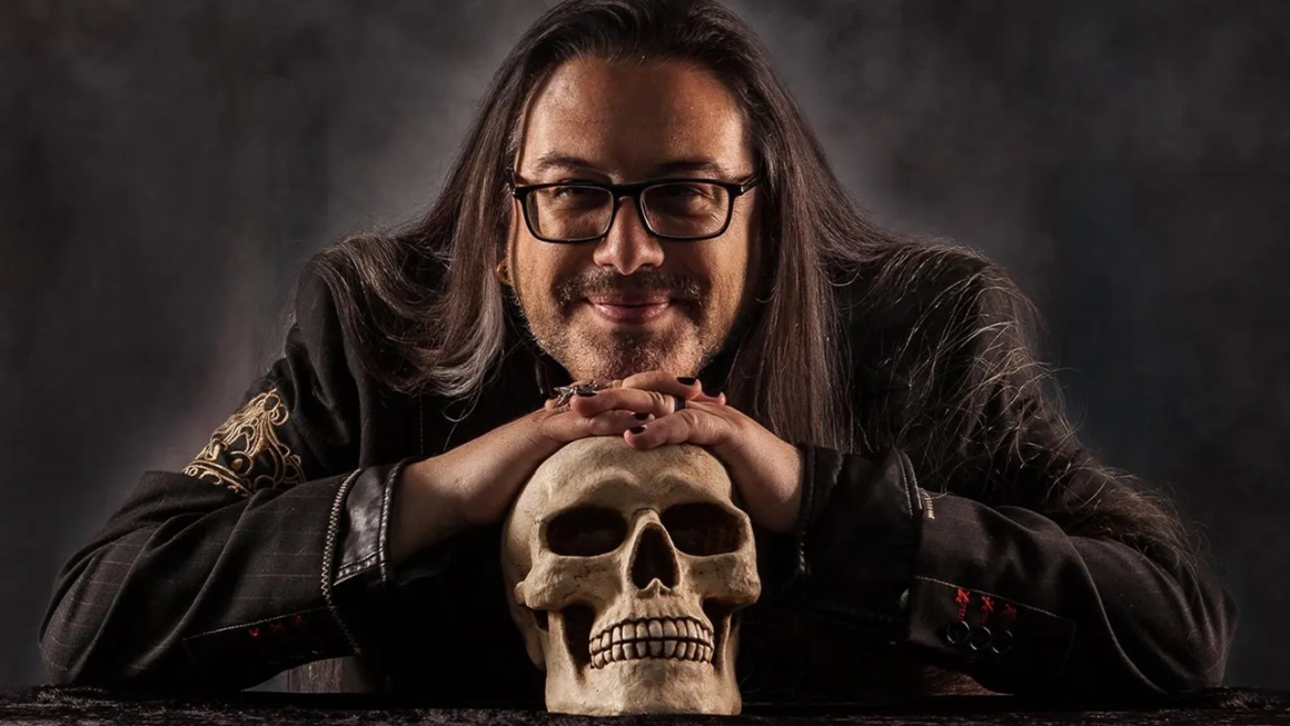 John Romero posing with a skull.