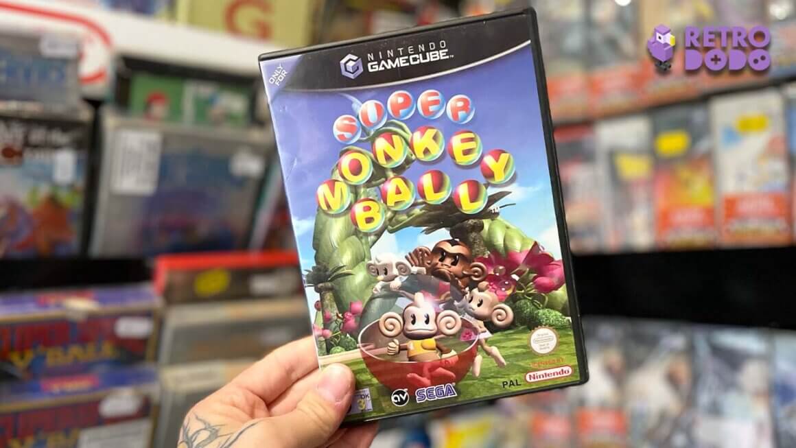 Seb holding a copy of Super Monkey Ball for the GameCube