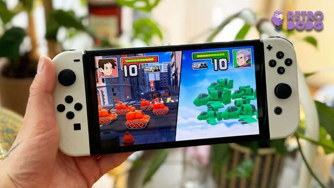 Seb holding his Switch with Advance Wars playing