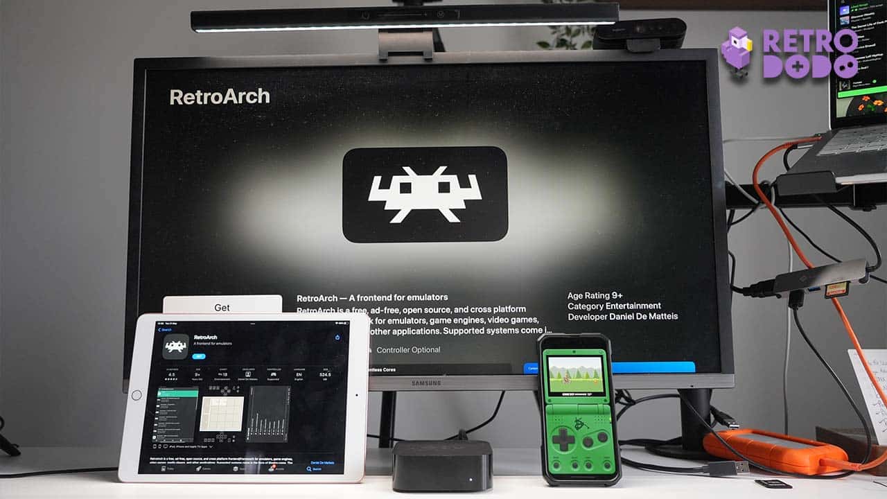 An iPhone, iPad and Apple TV showing emulators on a desk
