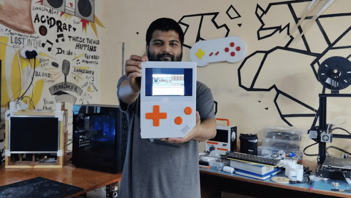 Arnov Sharma holding the Game Boy XL