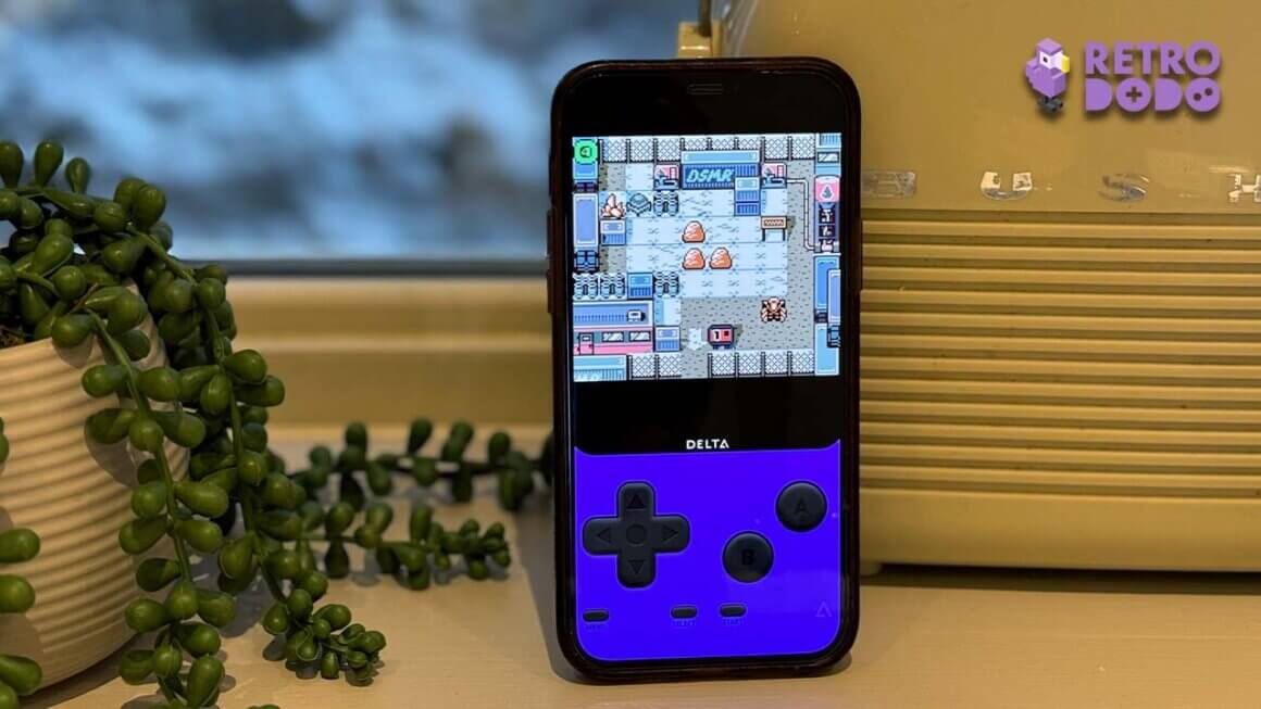 Seb's iPhone with the GBC skin next to a radio. Unearthed gameplay is on the screen