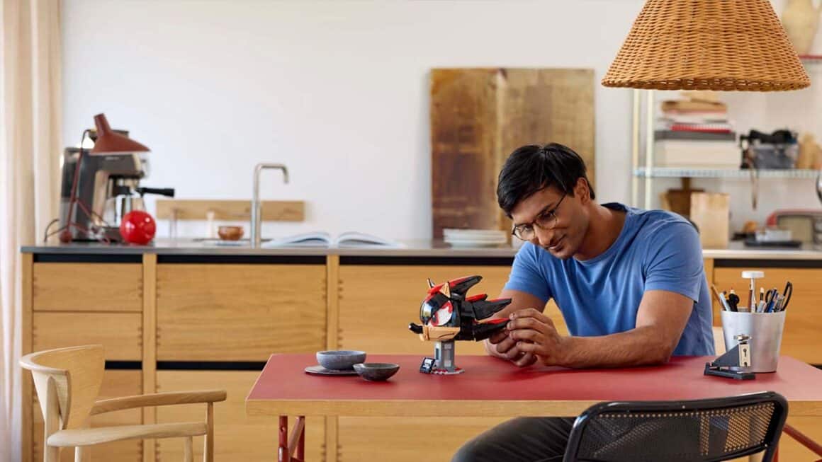 A man building the Shadow Lego Set