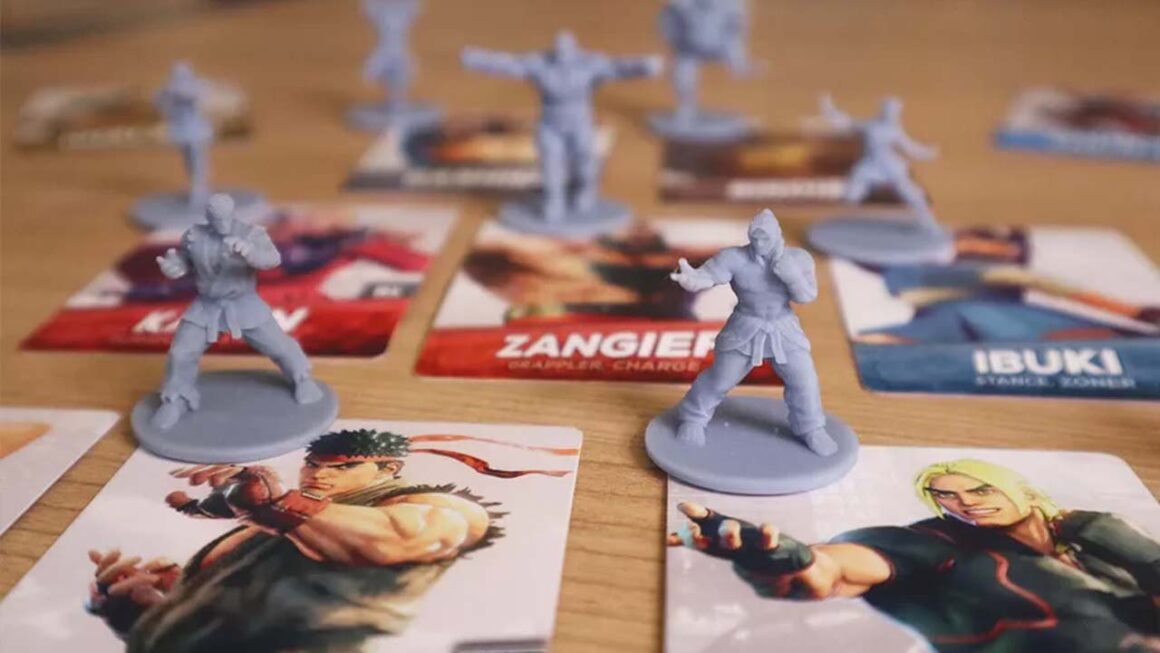 Image of figurines from the Street Fighter V: Champion Edition Legends Board Game 