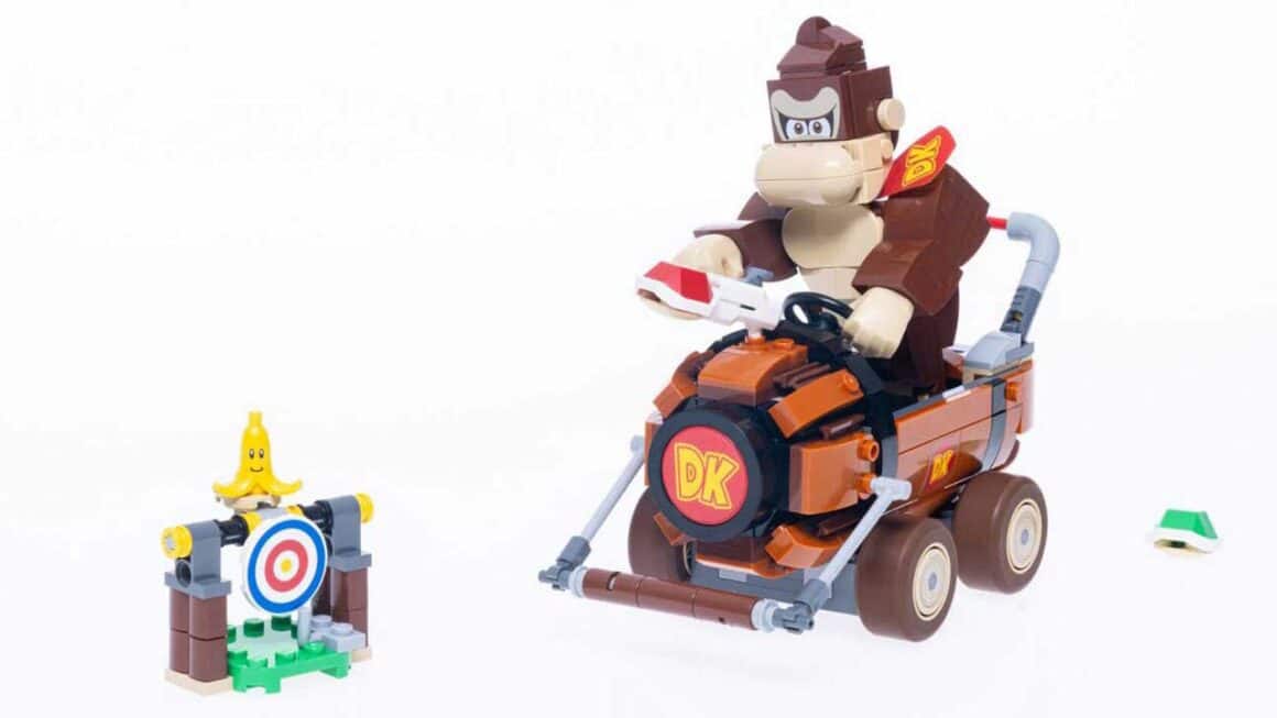 LEGO Donkey Kong on a Barrel kart with a banana on a target in front of him