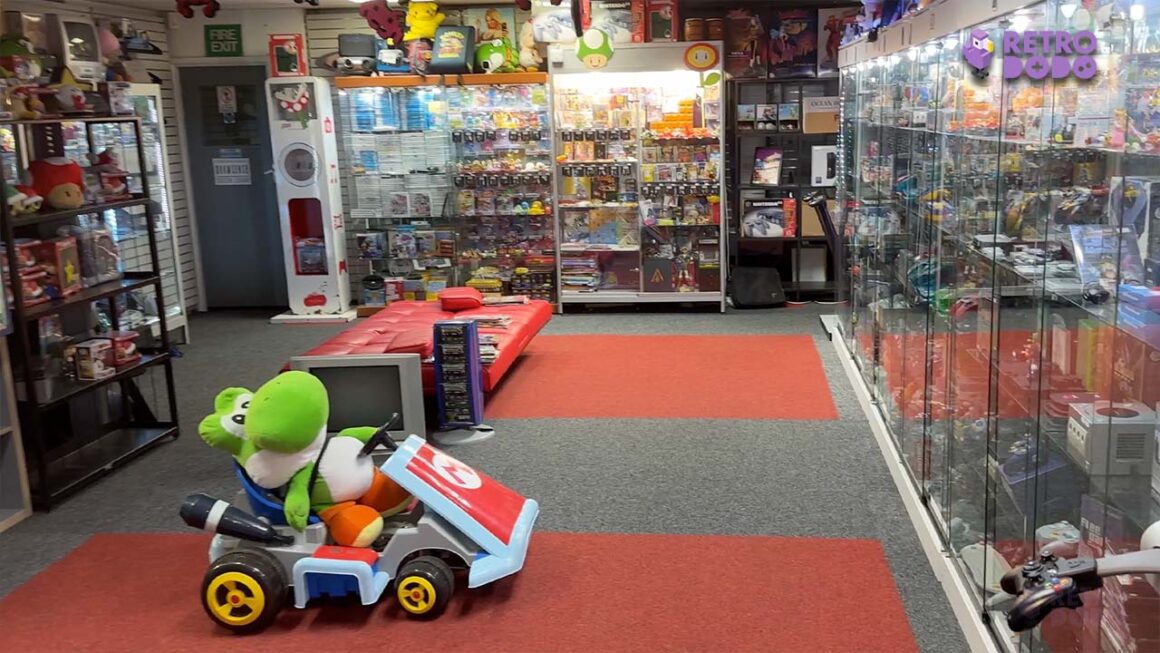 Retro Games HQ in Swindon - a retro game shop with a huge plush Yoshi sitting in a Mario Kart kart