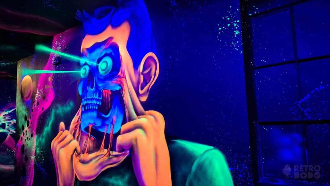 Neon artwork of a person pulling skin from their face to reveal a metallic skeleton underneath