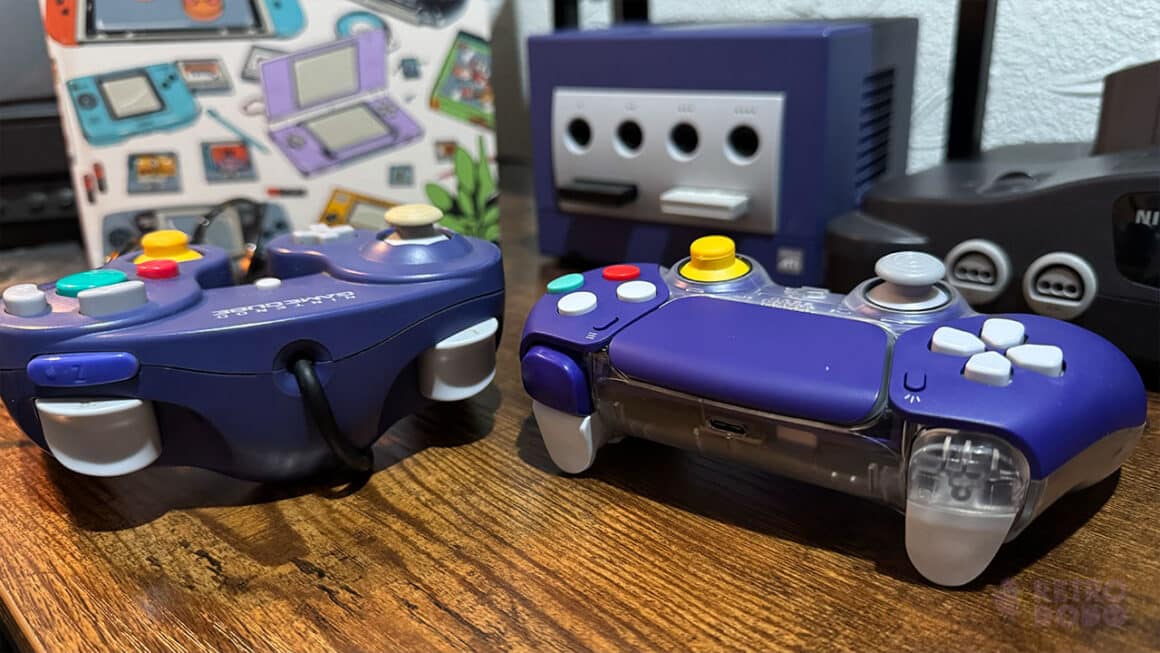 A GameCube remote and the CubeSense side by side with retro consoles in the background