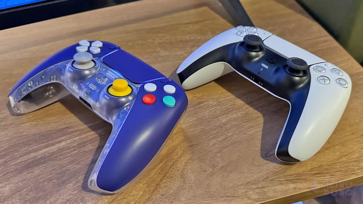 A PS5 DualSense controller (White) next to the indigo CubeSense controller