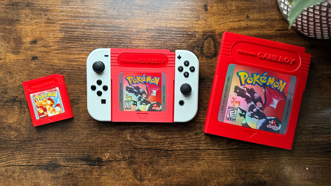 Pokémon red Game Boy game (left), Two white joycons attached to a joycon holder in the likeness of Pokémon Red (centre), A jumbo version of Pokémon Red (right)